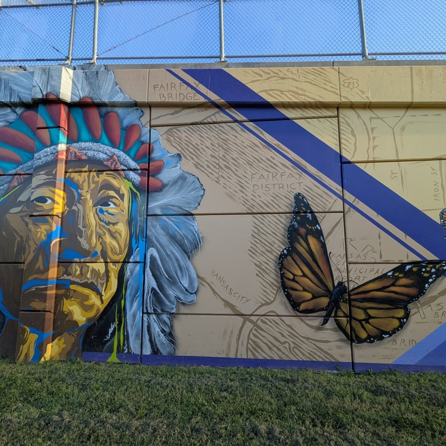 Mural of a Native American elder with a monarch butterfly